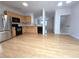 Open kitchen with stainless steel refrigerator and access to the living area at 2104 Meadow Peak Rd, Duluth, GA 30097