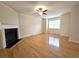 Spacious living room with hardwood floors, fireplace, and large window at 2104 Meadow Peak Rd, Duluth, GA 30097