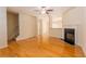 Spacious living room with hardwood floors and a cozy fireplace at 2104 Meadow Peak Rd, Duluth, GA 30097