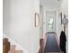 Inviting entryway with hardwood floors, coat rack and stairway with neutral decor at 230 Fender Walk, Marietta, GA 30060