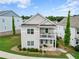 Beautiful two-story home boasts a lovely front balcony and manicured landscaping at 230 Fender Walk, Marietta, GA 30060
