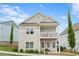 Charming two-story home with a welcoming front porch and second story balcony at 230 Fender Walk, Marietta, GA 30060