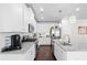 Well-equipped kitchen with granite countertops, stainless steel appliances, and a functional island sink at 230 Fender Walk, Marietta, GA 30060