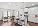 Open kitchen and breakfast area with granite counters, stainless appliances, and seating for three at 230 Fender Walk, Marietta, GA 30060