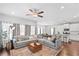 Open-concept living room featuring a spacious seating area and lots of natural light at 230 Fender Walk, Marietta, GA 30060