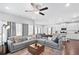Open-concept living room featuring a spacious seating area and a modern ceiling fan at 230 Fender Walk, Marietta, GA 30060