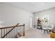 Cozy upstairs loft with seating area, natural light, and neutral carpeting at 230 Fender Walk, Marietta, GA 30060