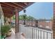 Spacious balcony overlooking a parking lot with apartment buildings in the background at 1705 Monroe Ne Dr # D05, Atlanta, GA 30324