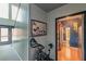 Inviting hallway featuring unique artwork, wood floors, and a view into a bathroom at 1705 Monroe Ne Dr # D05, Atlanta, GA 30324