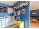 Cozy kitchen featuring stainless steel pans, white cabinets, and a yellow storage cabinet at 1705 Monroe Ne Dr # D05, Atlanta, GA 30324