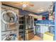 Apartment kitchen featuring stainless steel appliances, in-unit laundry, and ample shelving at 1705 Monroe Ne Dr # D05, Atlanta, GA 30324