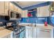 Apartment kitchen featuring gas range, stainless appliances, and white cabinets at 1705 Monroe Ne Dr # D05, Atlanta, GA 30324
