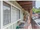 Cozy outdoor patio with seating, brick flooring, and view of the complex grounds, perfect for relaxing and entertaining at 1705 Monroe Ne Dr # D05, Atlanta, GA 30324