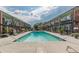 Inviting pool surrounded by lounge chairs with tan and brick condo units in the background, perfect for relaxation at 1705 Monroe Ne Dr # D05, Atlanta, GA 30324