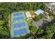 Aerial view of community amenities including tennis courts, a volleyball court, and a swimming pool at 2802 Arabian Ne Trl, Marietta, GA 30062