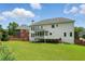Expansive backyard featuring a lush green lawn and a well-maintained two-story home exterior at 2802 Arabian Ne Trl, Marietta, GA 30062