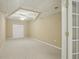 Cozy room in the basement features neutral carpet and a modern ceiling fan with lights at 2802 Arabian Ne Trl, Marietta, GA 30062