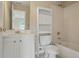 A bright bathroom features a vanity, toilet with storage, and a shower and tub combination at 2802 Arabian Ne Trl, Marietta, GA 30062