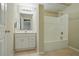 Bathroom with a vanity and mirror next to a shower and tub combination at 2802 Arabian Ne Trl, Marietta, GA 30062