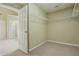 Walk-in closet with carpet flooring and metal shelving for storing clothing and accessories at 2802 Arabian Ne Trl, Marietta, GA 30062