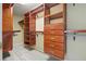 A large walk-in closet features wooden storage solutions including shelves, drawers, and clothing racks at 2802 Arabian Ne Trl, Marietta, GA 30062