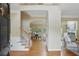 Inviting foyer with hardwood floors, staircase, and arched entryway to the dining room at 2802 Arabian Ne Trl, Marietta, GA 30062