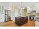 Bright kitchen with island, stainless steel appliances, granite countertops and white cabinetry at 2802 Arabian Ne Trl, Marietta, GA 30062