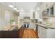 Gourmet kitchen featuring granite countertops, stainless steel appliances, and dark wood island with seating at 2802 Arabian Ne Trl, Marietta, GA 30062