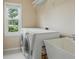 Convenient laundry area features a utility sink and modern washer and dryer at 2802 Arabian Ne Trl, Marietta, GA 30062