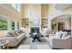 Cozy living room with tall windows, built-in shelving, fireplace, and plush seating at 2802 Arabian Ne Trl, Marietta, GA 30062