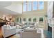 Open-concept living room with a fireplace and seamless flow to the kitchen and dining area at 2802 Arabian Ne Trl, Marietta, GA 30062