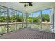 A charming sunroom features a wood floor and screened windows with a backyard view at 2802 Arabian Ne Trl, Marietta, GA 30062