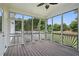 A charming sunroom features a wood floor and screened windows with a backyard view at 2802 Arabian Ne Trl, Marietta, GA 30062