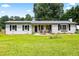 Charming single-story home featuring white brick, black shutters and a well-maintained lawn at 2905 Jim Owens Nw Rd, Kennesaw, GA 30152