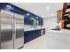 Modern kitchen with custom blue cabinetry, stainless steel appliances, and quartz countertops at 2905 Jim Owens Nw Rd, Kennesaw, GA 30152