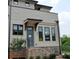 Inviting townhome entrance with brick accents, modern door, and well-maintained landscaping at 297 White St # 1, Marietta, GA 30060