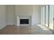 Bright living room featuring a sleek fireplace, hardwood floors, and sliding glass doors at 297 White St # 1, Marietta, GA 30060