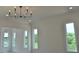 Bright living room with modern chandelier, recessed lighting and an abundance of natural light at 297 White St # 1, Marietta, GA 30060