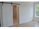 Spacious main bedroom boasts an en suite bath and sunny window at 297 White St # 1, Marietta, GA 30060