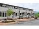 Charming new townhomes with inviting entrances and manicured landscaping line a freshly paved street at 297 White St # 1, Marietta, GA 30060