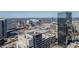 Aerial view showcases the city skyline with modern buildings and vast parking areas at 20 Marietta Nw St # 15D, Atlanta, GA 30303
