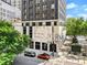 The Metropolitan building has an urban exterior with modern design elements, trees, and street views at 20 Marietta Nw St # 15D, Atlanta, GA 30303