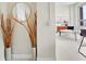 Stylish foyer featuring decorative vases, round mirror, and light hardwood floors at 20 Marietta Nw St # 15D, Atlanta, GA 30303