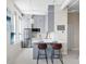 Modern kitchen featuring stainless steel appliances, an island with seating, and white countertops at 20 Marietta Nw St # 15D, Atlanta, GA 30303