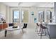 Bright living room with dining area, modern decor, and plenty of sunlight at 20 Marietta Nw St # 15D, Atlanta, GA 30303