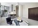 Spacious, open-concept living space with modern kitchen, seating area, and unique marble table at 20 Marietta Nw St # 15D, Atlanta, GA 30303