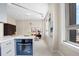 Open-concept living space featuring a kitchen, seating area, and large windows at 20 Marietta Nw St # 15D, Atlanta, GA 30303