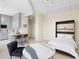 Open concept area with modern kitchen, bedroom murphy bed and seating area with marble table at 20 Marietta Nw St # 15D, Atlanta, GA 30303