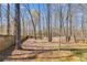 Large private backyard with wooden fence and mature trees at 245 Raleigh Way, Villa Rica, GA 30180