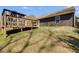 View of the backyard and the wooden deck that provides access to the house at 245 Raleigh Way, Villa Rica, GA 30180
